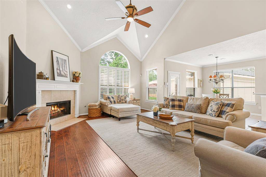 The high ceiling, abundance of windows and a cozy gas fireplace create a warm and inviting space to relax.