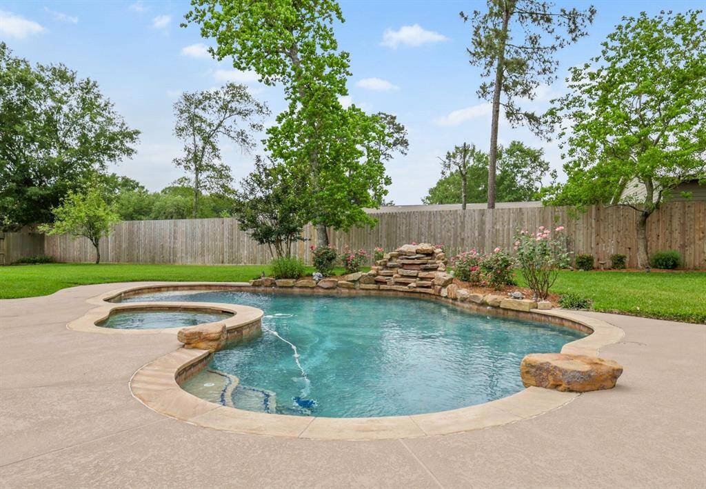 Beautiful roses and landscaping enhance the beauty of the heated pool and jacuzzi.  Ready for year round entertainment.