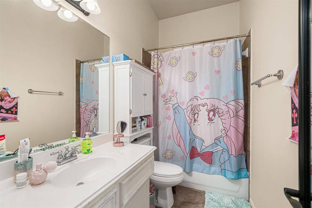 secondary bedroom's dedicated ensuite bathroom - perfect for guests or family members seeking a private sanctuary.
