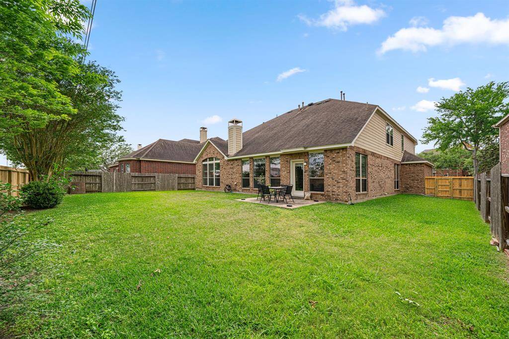 This expansive backyard offers exceptional privacy with no rear neighbors and features mature landscaping that provides natural beauty. The property includes an additional large side yard, perfect for outdoor entertaining or play