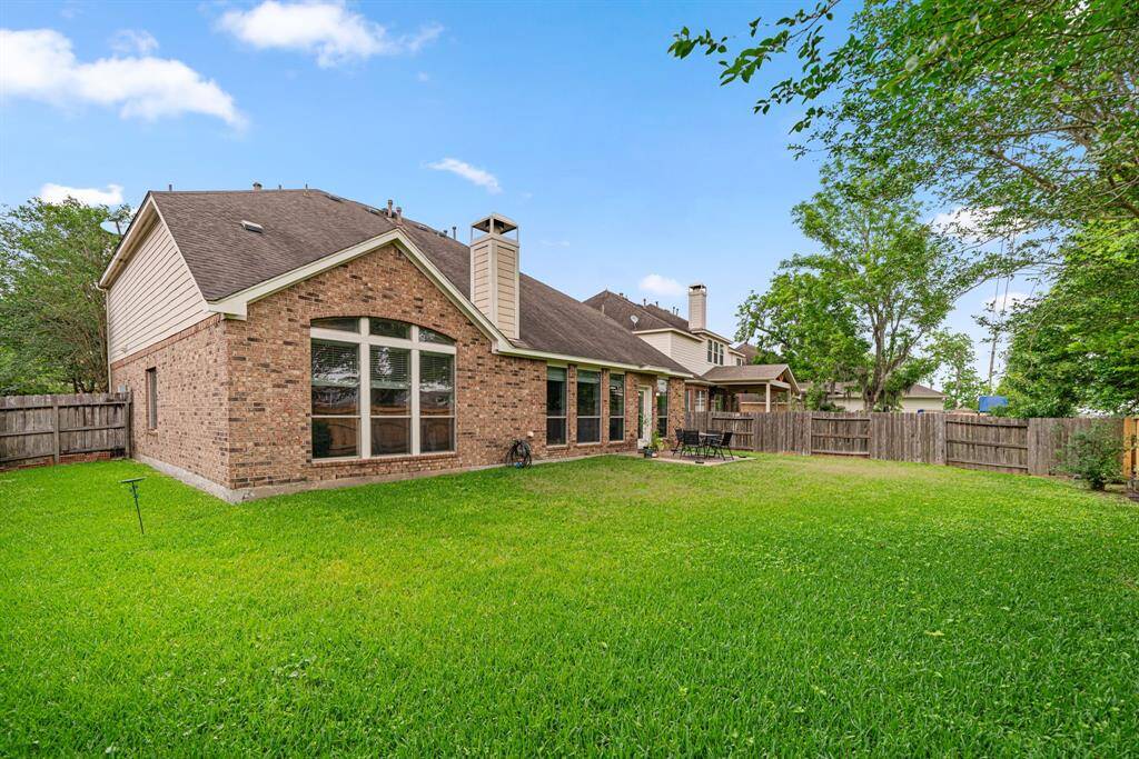 This expansive backyard offers exceptional privacy with no rear neighbors and features mature landscaping that provides natural beauty. The property includes an additional large side yard, perfect for outdoor entertaining or play
