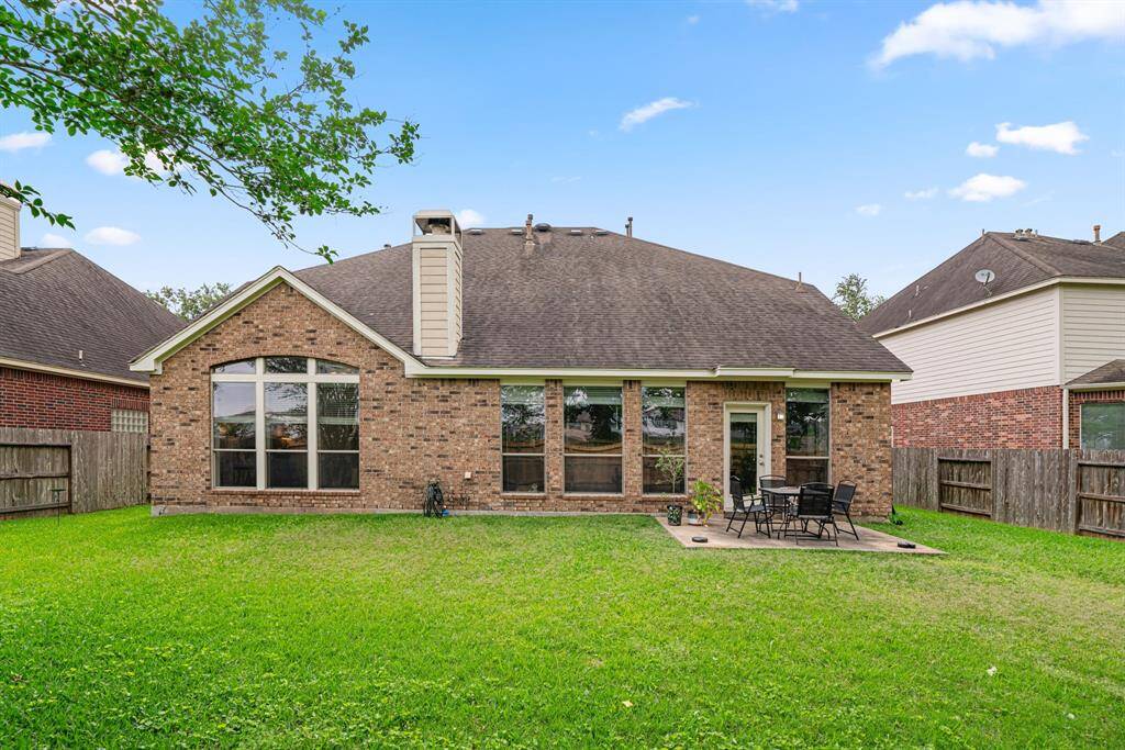 This expansive backyard offers exceptional privacy with no rear neighbors and features mature landscaping that provides natural beauty. The property includes an additional large side yard, perfect for outdoor entertaining or play
