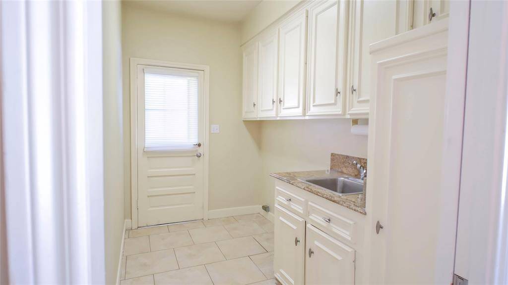 Laundry room leading to backyard