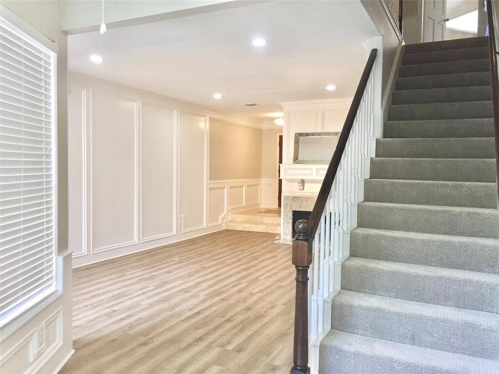 THE CARPETED STAIRWAY leads to a LARGE UPSTAIRS STUDY SPACE or TV LOUNGE and Two Bedrooms with en-suite baths.