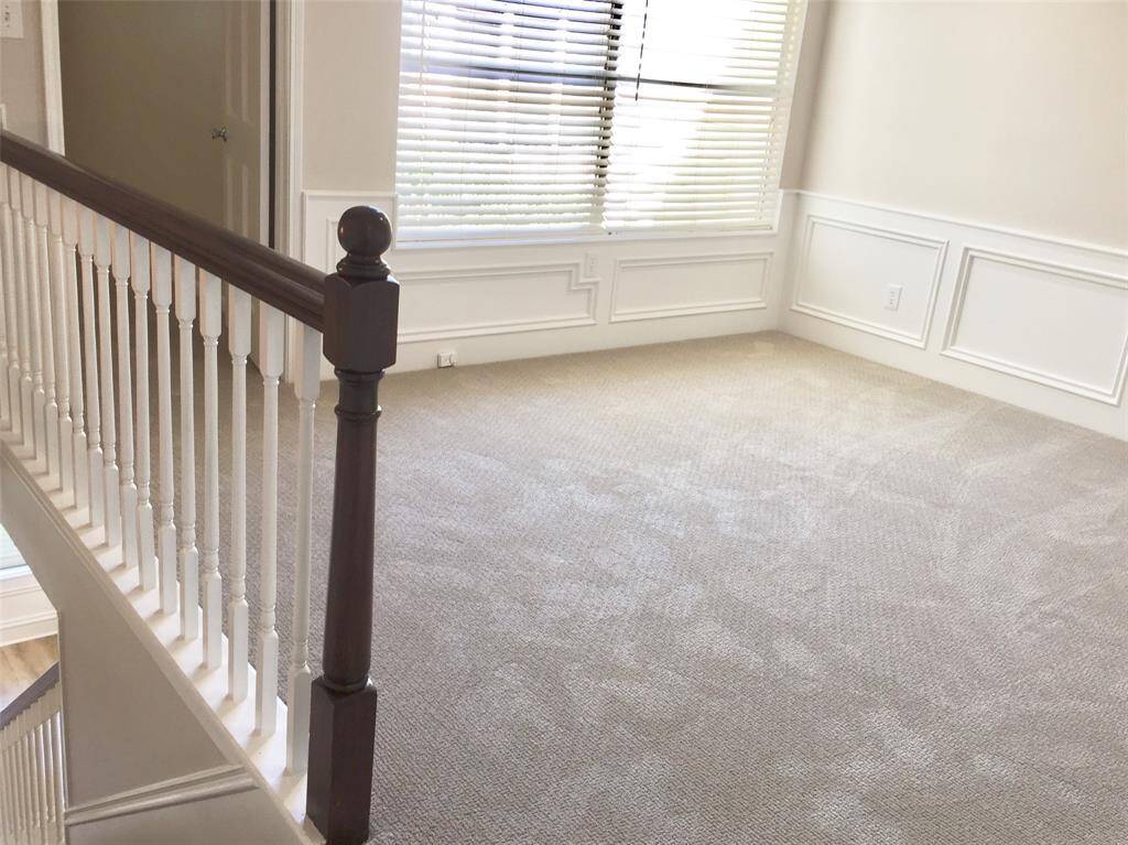 THE UPSTAIRS LANDING is quite large with room for couches, tables or maybe a pool table.