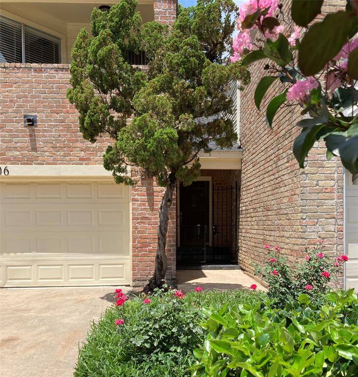 Recessed Front Entrance with Wrought Iron Security gate.