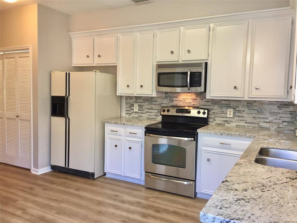 ROOMY KITCHEN with plenty of cabinet storage.