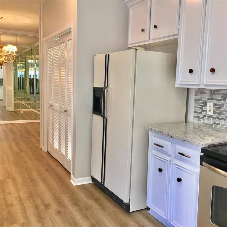 THIS PASSAGE WAY leads from the Kitchen to the LAUNDRY ROOM , GUEST HALF-BATH, and MAIN DINING ROOM