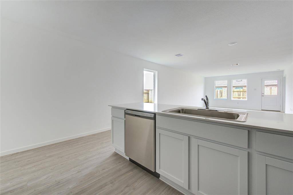 Sleek, white shaker-style cabinets that provide a clean and timeless look