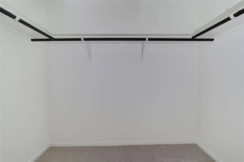 Walk-in closet with a simple, clean layout