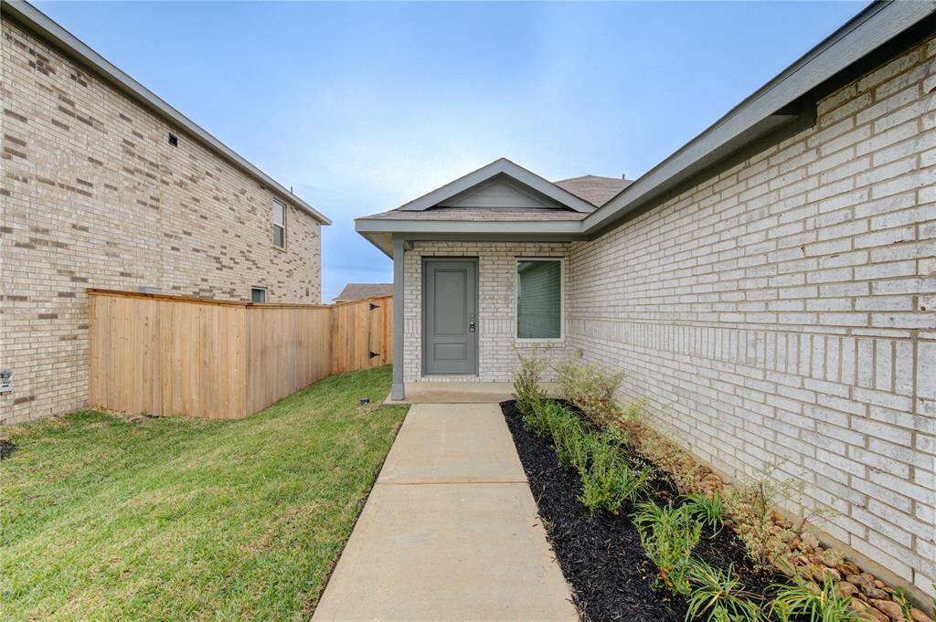 Charming entry with a concrete walkway