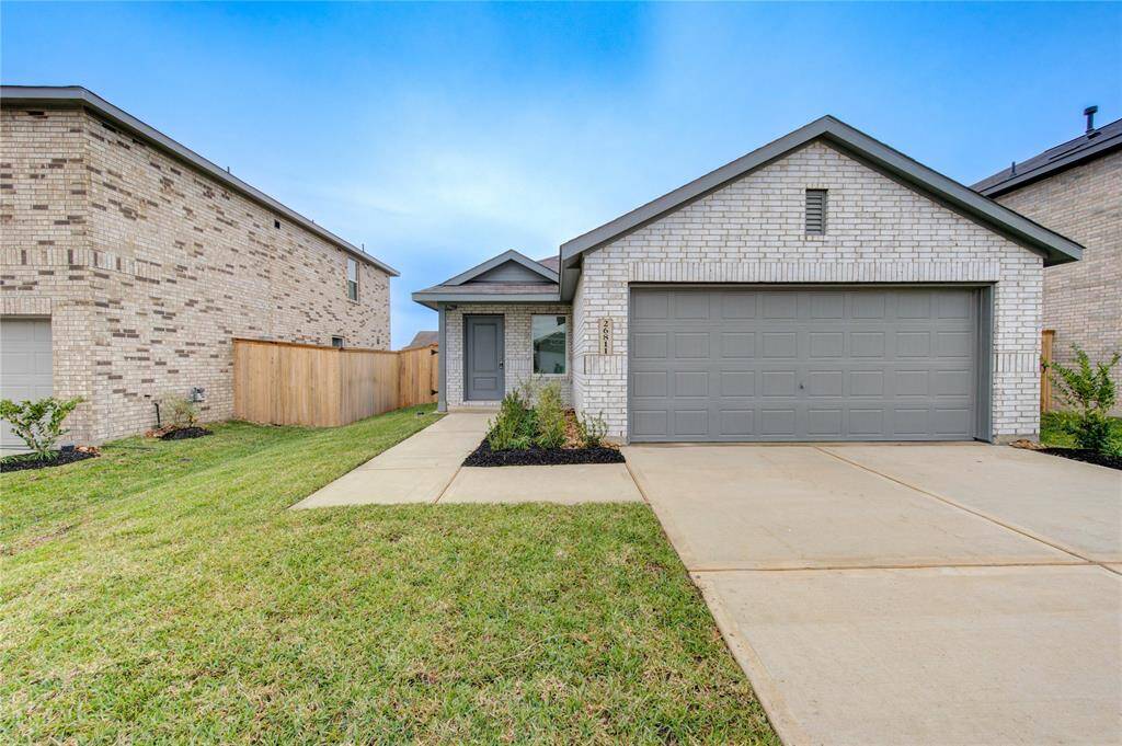Gray garage and tidy front yard