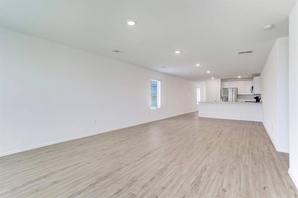 Kitchen looks out to family space - nice bar area for barstools