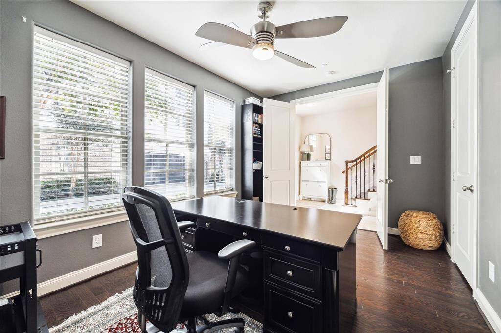 Three large south-facing windows with custom blinds capture glorious natural light in this spacious suite.
