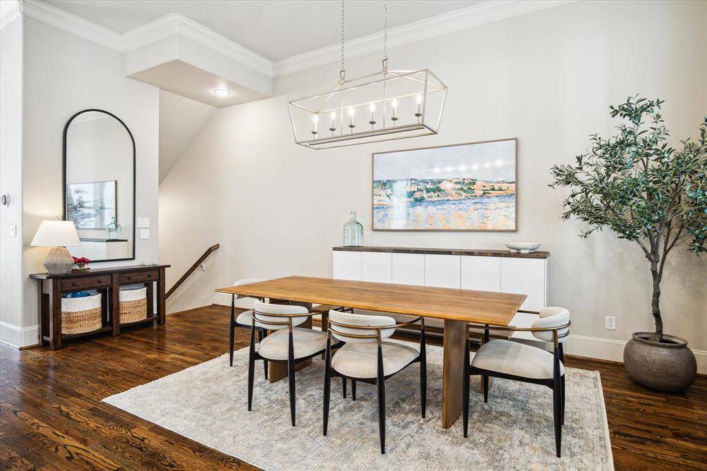 Past the dining room, stairs lead to the first floor and foyer.
