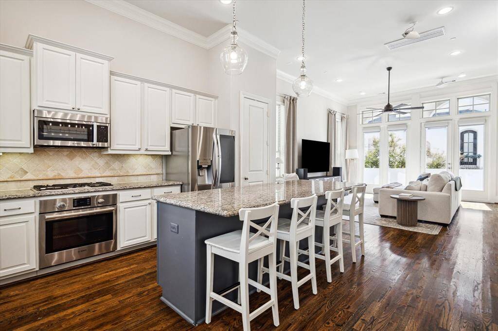 Cooking and cleaning are a joy with a fleet of upscale Bosch stainless steel appliances, including a five-burner cooktop, electric oven, dishwasher and microwave, plus an LG InstaView refrigerator.