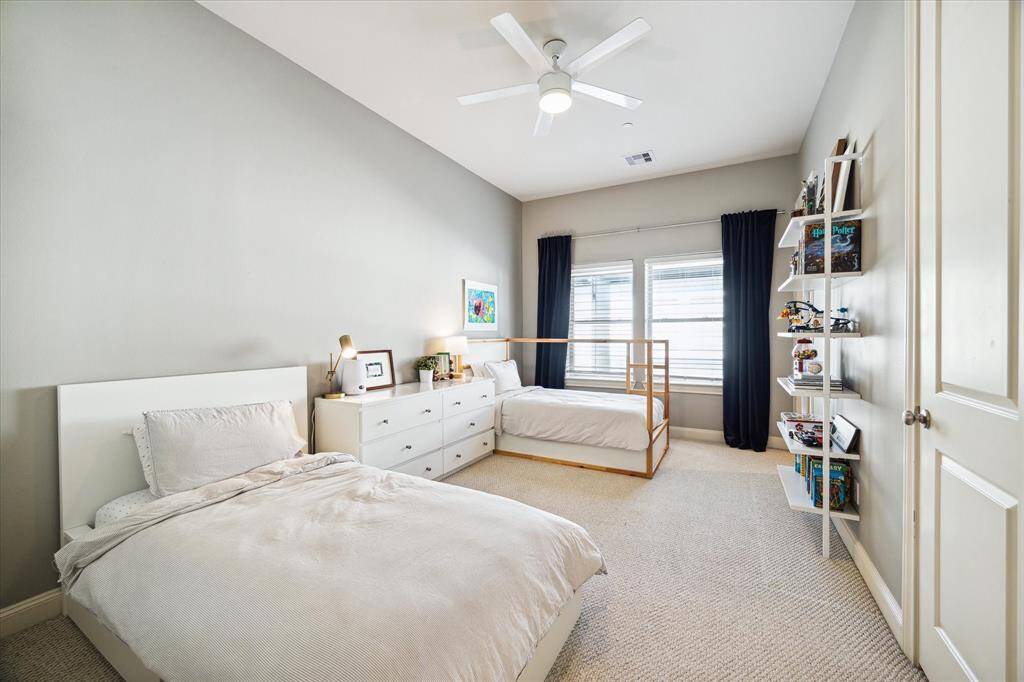 The oversized third floor bedroom easily accommodates two beds within easy reach of a fourth full bathroom.