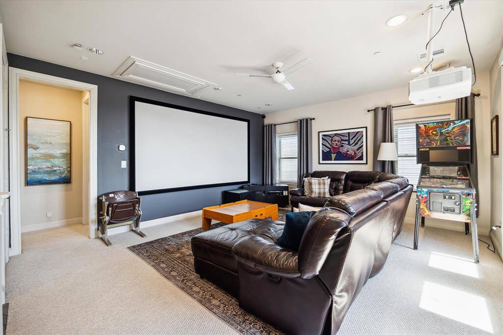This indoor-outdoor game room is the perfect destination for epic movie nights thanks to A/V wiring, ceiling-mounted speakers and motorized blinds.