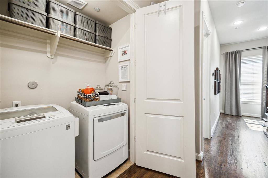 Laundry day is effortless with a convenient third-floor laundry closet with gas and electric connections, tile flooring, a hanging rod and shelving.
