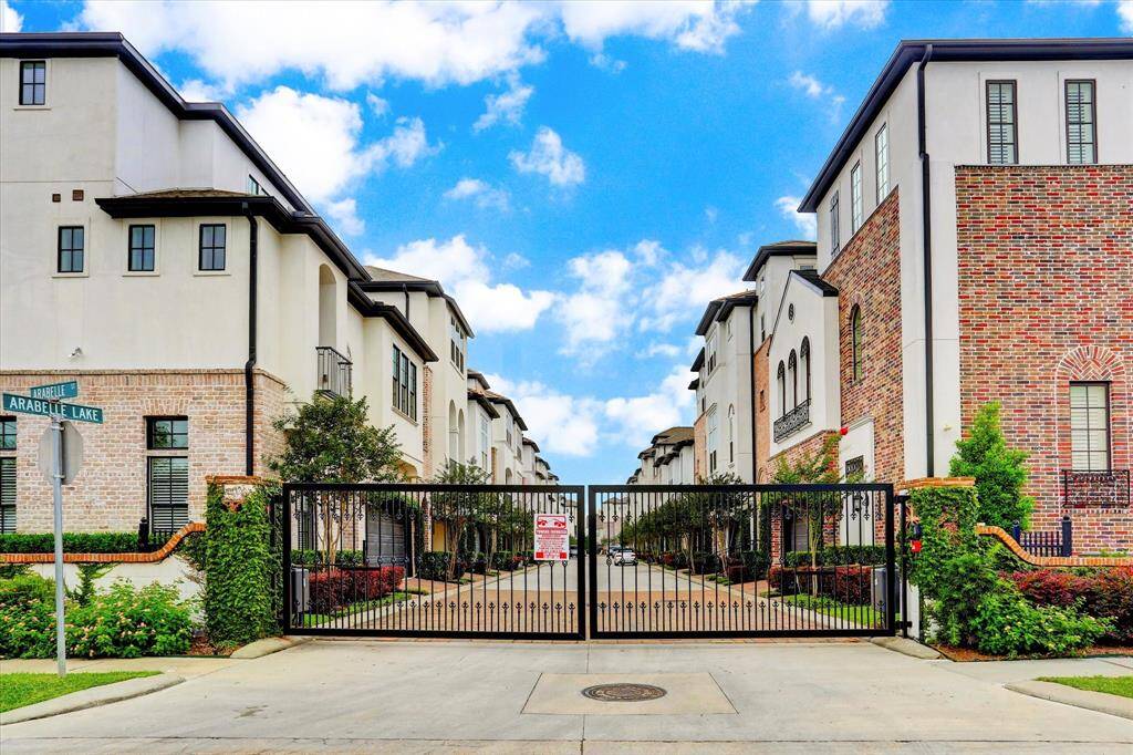Motorized gates lead to your attached two-car garage, where you’ll find under-stair storage and an oversized storage closet.