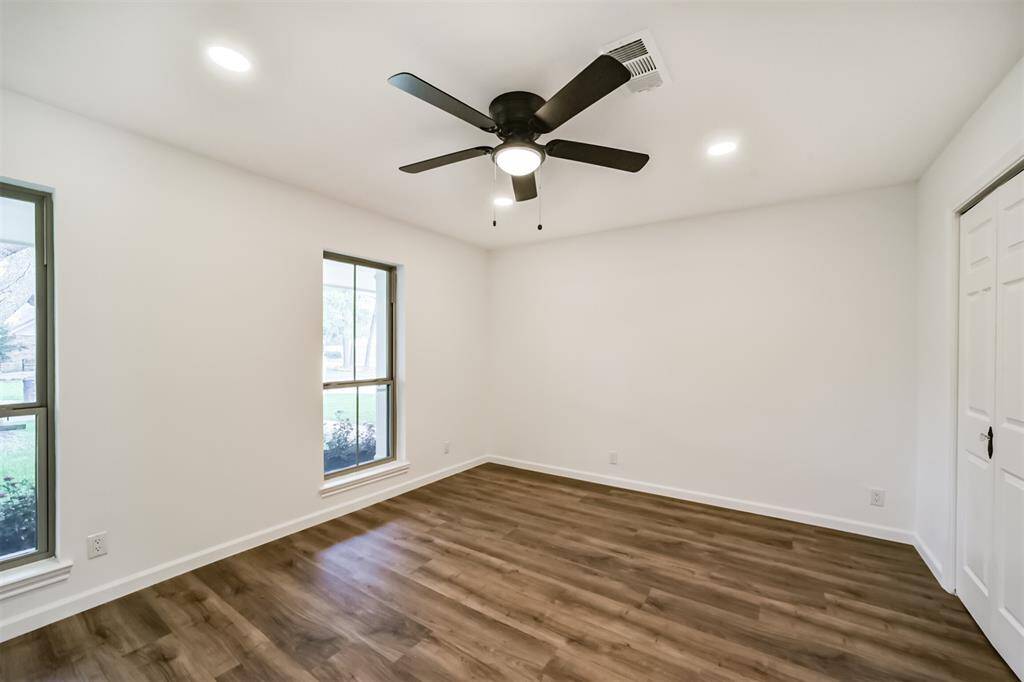 Bedroom 2 and 3 off the hallway share a full bathroom with double vanities and shower tub combo