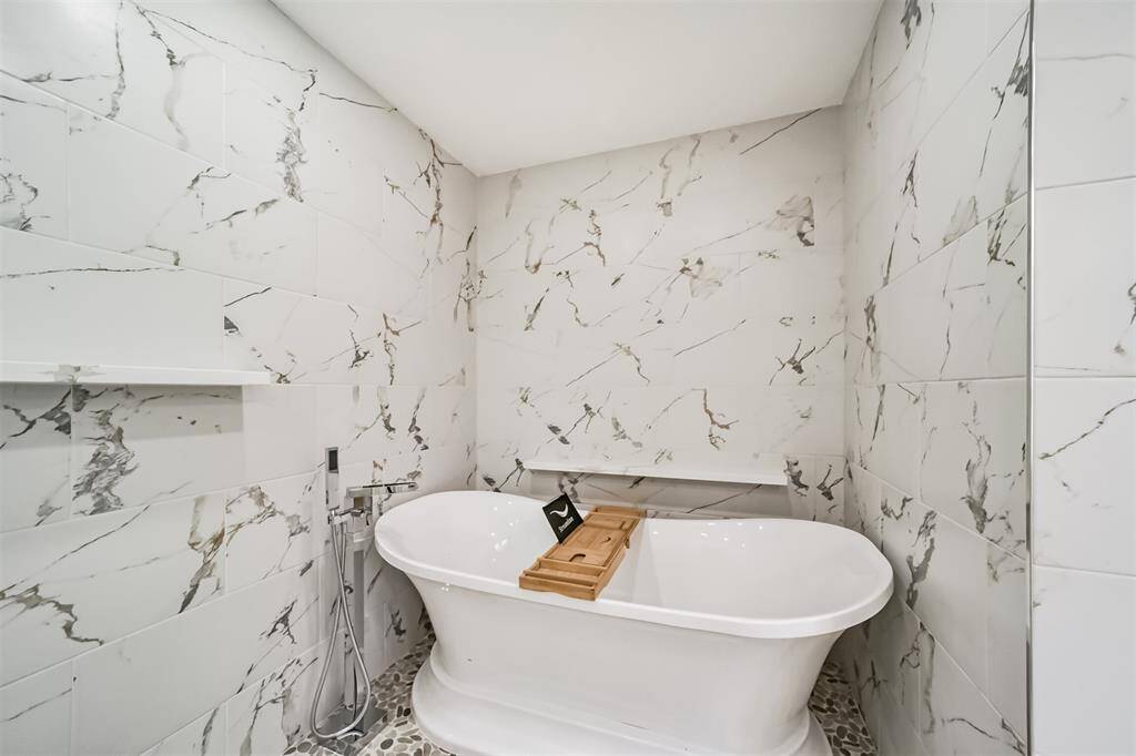 Melt stress away in this oversized soaking tub to complete your spa like experience