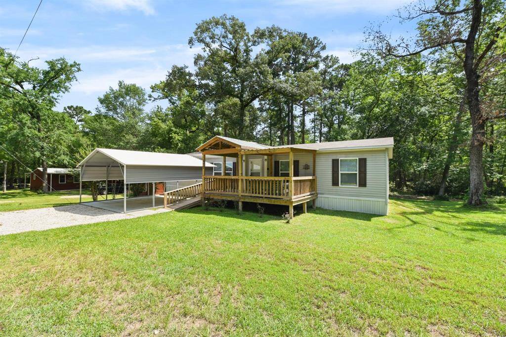 Covered parking with a large front porch.