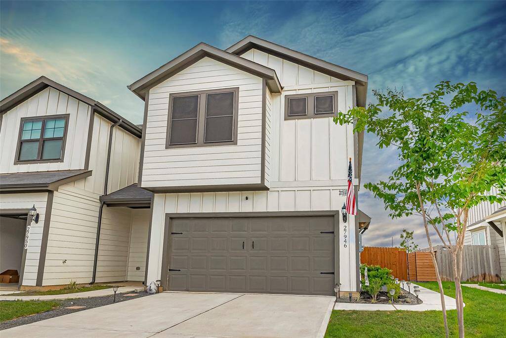 Charming modern exterior with a two-car garage and low-maintenance landscaping