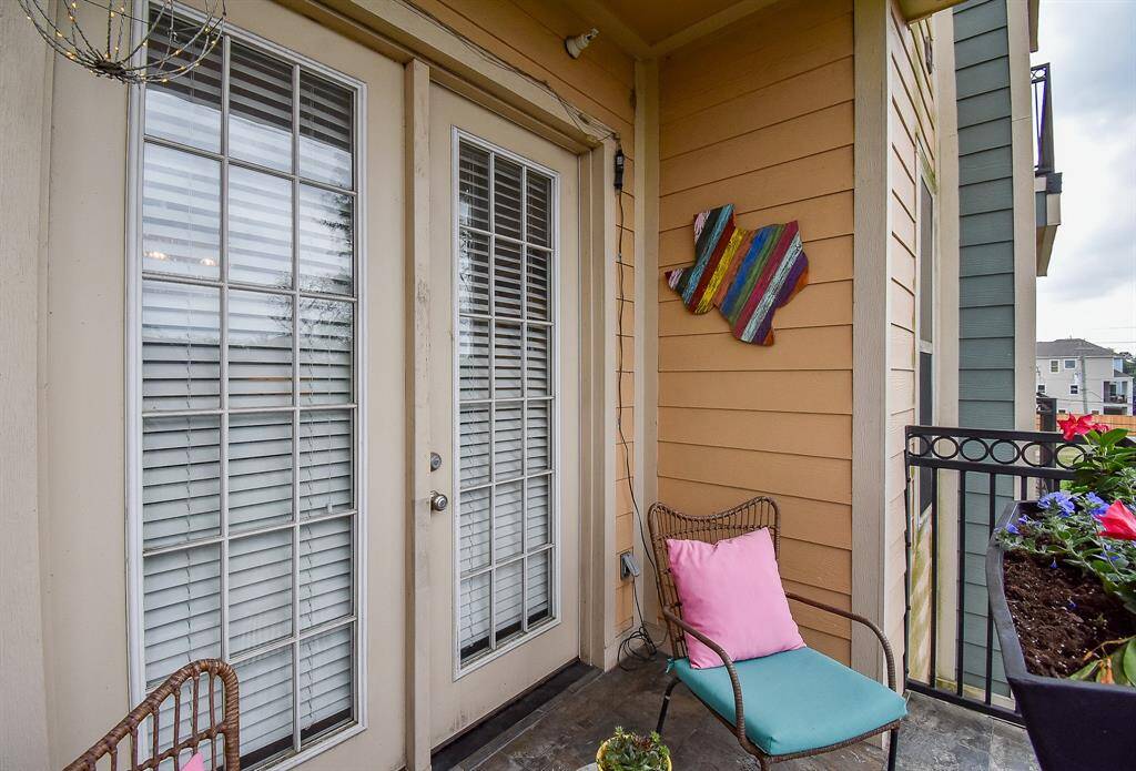 Step outside to a cozy balcony retreat with peaceful views and fresh air!