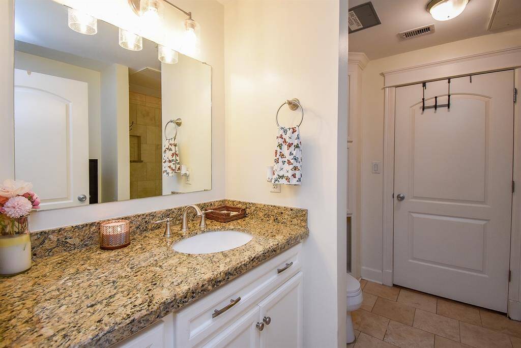 Full bathroom with dual access from the hallway and primary suite—perfect for guests or privacy!