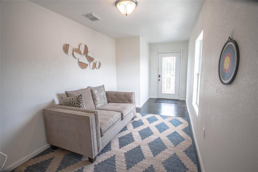 This is Shared living space for unit three and four and the door straight ahead takes you out to a balcony and this is off the shared dining area. Remember possibilities!