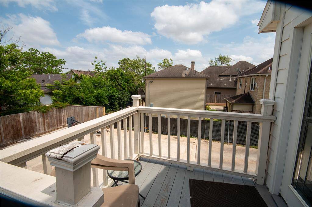 We open door to shared living area and this balcony gives you great view of the back yard
