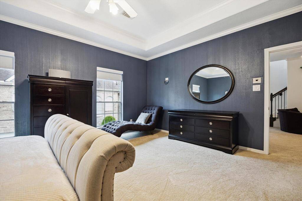 Bright and open with carpet flooring and ceiling fan, offering endless possibilities to fit your lifestyle needs.