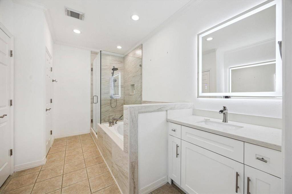 Elegant primary suite in the second floor with tray ceilings, soft natural light, and a spacious layout—your private retreat awaits.