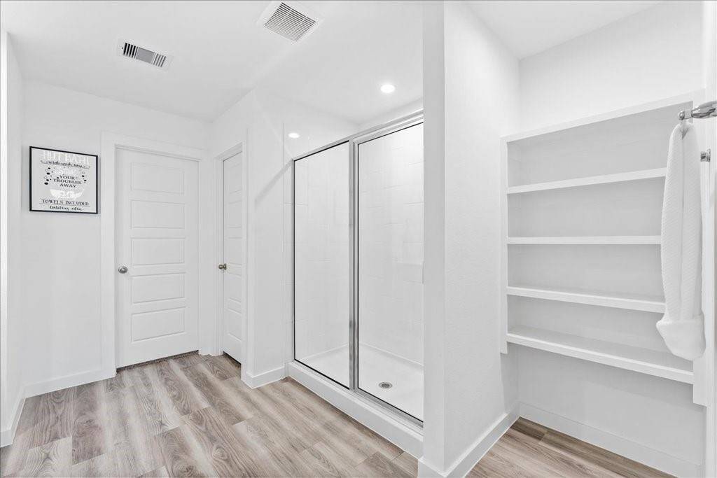 Primary Bathroom with a walk in shower.