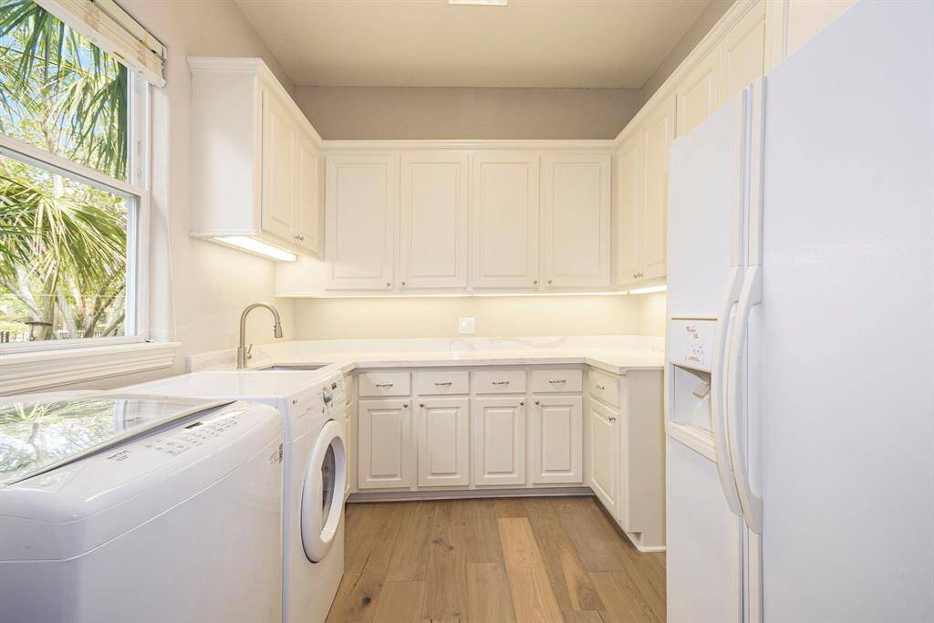 Endless amounts of storage in this home! New granite counters and sink in the laundry room