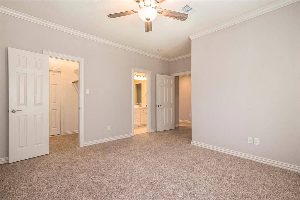 2nd upstairs bedroom also has access to a large walk in attic storage space with built ion shelving