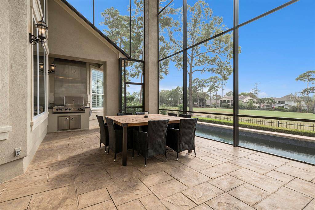 Enjoy the views of the pool, lake and golf course from the screened in patio