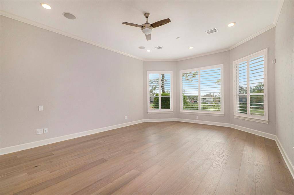 Primary bedroom with plantation shutters