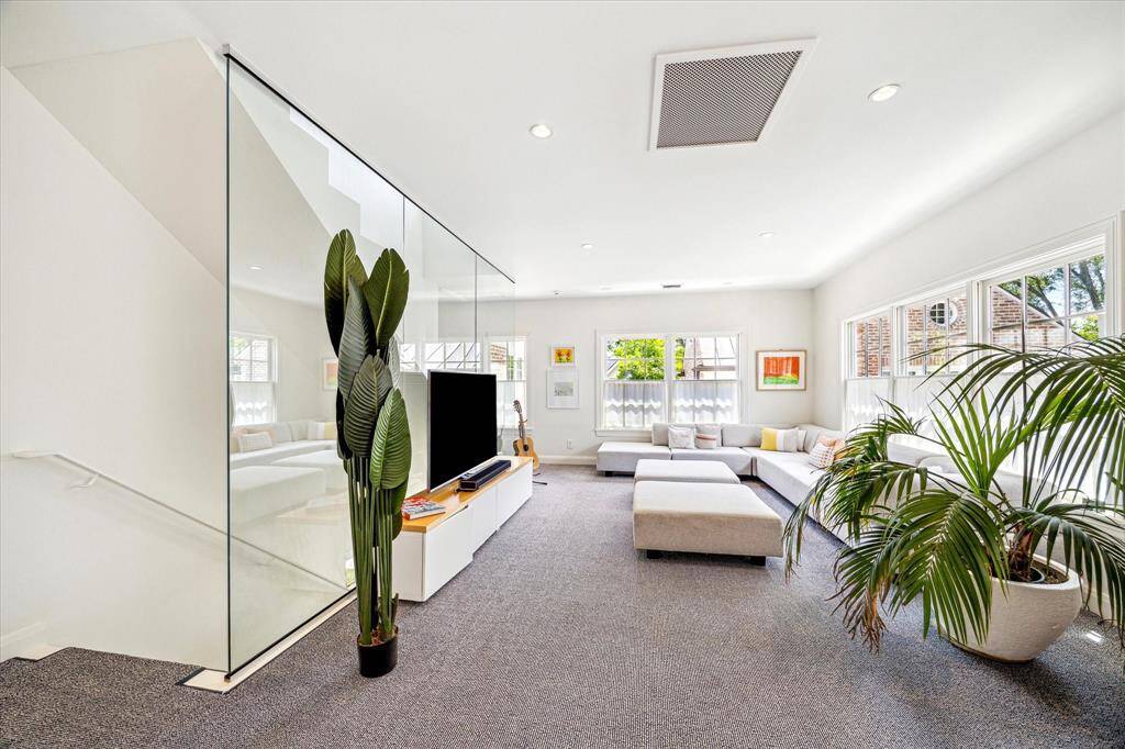 Centrally positioned, the second-floor landing connects the home’s private spaces with ease and elegance. Brightened by natural light and accented by classic millwork, it serves as both a functional passageway and a charming architectural moment.