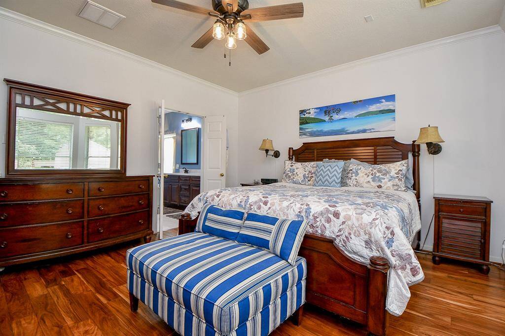 A wall of bay windows brightens your primary suite; your luxurious personal, private place of peace and repose.