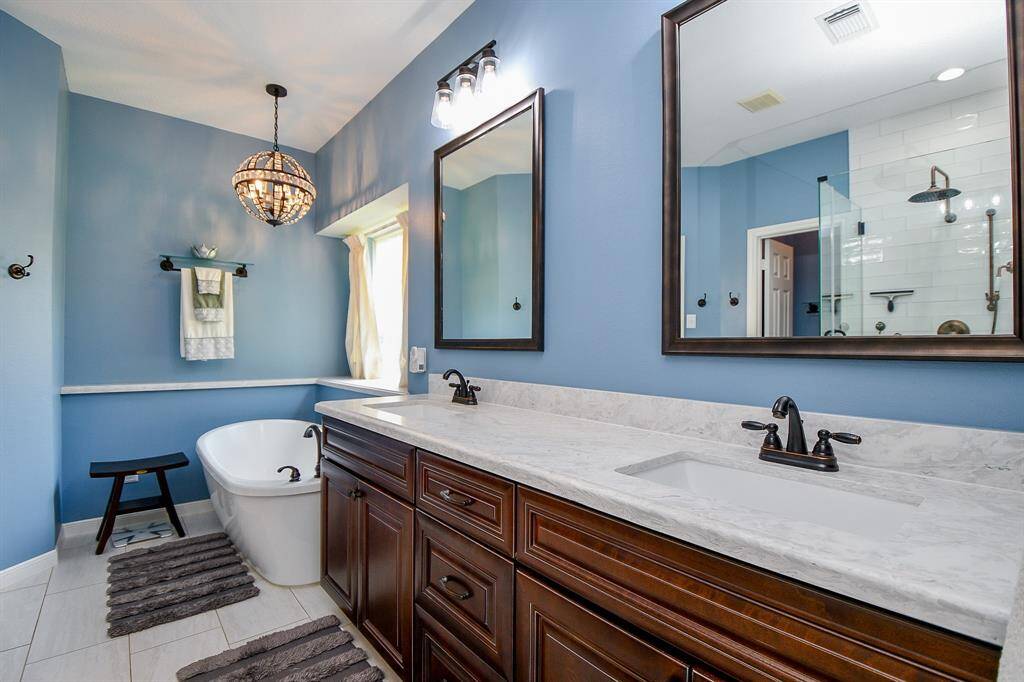 Your primary ensuite bath is right through the open doors.