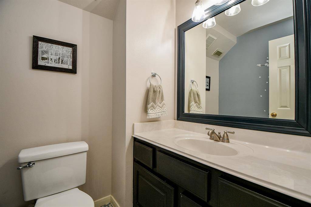 . . . or choose a quick, brisk shower in the large walk-in, rimless, glass enclosed shower.