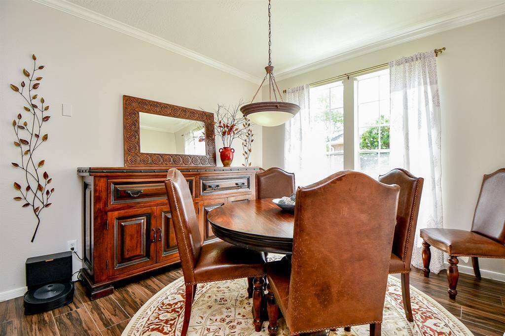 This is the inside view of the charming front entrance, with formal dining (left) and rich office space (right) beyond quaint, classic french doors.