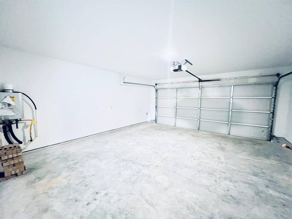 Garage included remote garage door opener and tankless water heater
