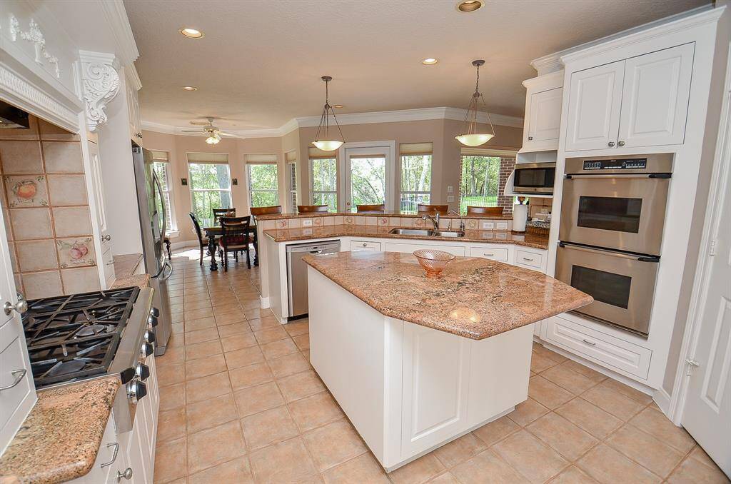 This Kitchen is truly a Culinary Dream!   Double Ovens, a 6 Burner Gas Stove, a Wine Refrigerator and so much more!