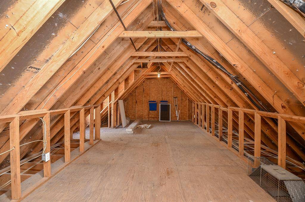 Huge Attic Space located off the bonus room.   This is one of a few floored attic spaces!