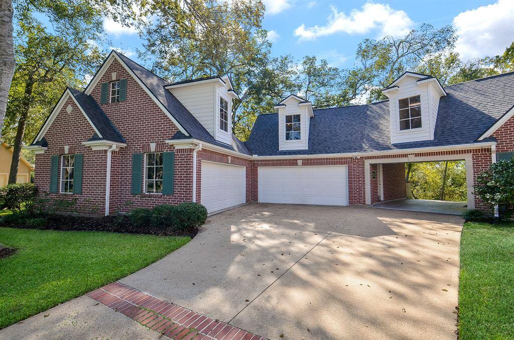 Showing off the 4 Car Garage that is connected to the house by the carport.