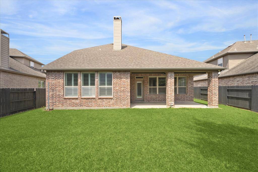 View of brick rear elevation, home was built in 2013 by Highland Homes. Four bedrooms, 3 full baths. Great opportunity for a meticulously maintained home reflecting pride of ownership! A pleasure to show and ready for lucky buyers.