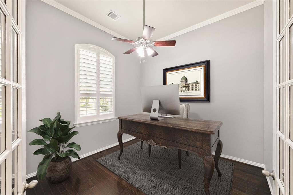 Nice sized private Study (12x12) right off entry overlooks the pretty front yard. Hardwood flooring and glass doors make for a great work space. Plantation shutters, crown molding with classic neutral palette. Virtually staged.